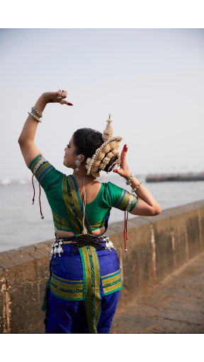 Upper body movements show smooth arm flow and steady posture in Kathak dance steps