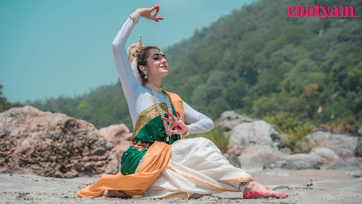 A solo dancer performs the Odissi classical dance form, representing the history of Odissi dance and its revival.